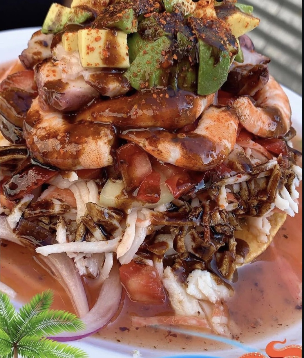Tostada especial loaded with shrimp, avocado & salsa